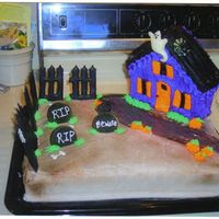 Halloween I used the house pan and decorated it for halloween. The fence is color flow, and the tomstones are cookies. Everything is iced in...