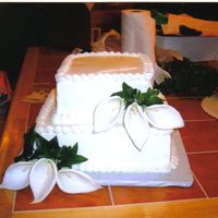 Wedding Cake Lillies white cake with strawberry filling and fresh strawberries and silk lillies