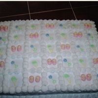 Figure Piping White cake iced in buttercream with buttercream figure piping.