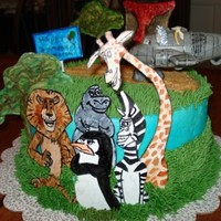 Madagascar Birthday Cake This is a cake I made for my nephew. The Madagascar animals, volcano and trees are all made out of gumpaste and hand painted.