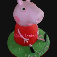 3D Peppa Pig Cake Vanilla sponge cake filled with IMBC and raspberry jam, covered in sugarpaste (fondant). The body is an 8" and a 7" stacked and...