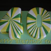 No. 40 Cake This is a big cake - the board measures 24x14"! The request from the customer was for a 4 & 0 in green white and yellow. All the...