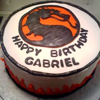 Mortal Kombat My nephew wanted a mortal kombat cake and this is what i came up with. WASC, chocolate filling, fondant and buttercream