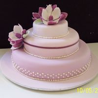 Port Wine Magnolia Wedding Cake My first wedding cake! Vanilla cake covered in fondant (my best friend) and decorations all made in gumpaste.