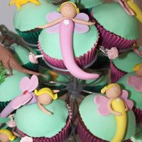 Fairy Cup Cakes A simple and effective Debbie Brown winner. Chocolate cupcakes with fondant decorations - so easy to do!!