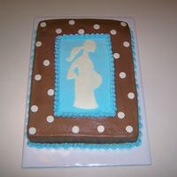 Pregnant Mom Silhouette SIL baby shower. choc BC, fondant accents, 1/2 fudge filling & 1/2 caramel filling on yellow cake. Not quite sure why is doesn't...