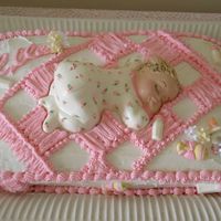 Girl Baby Shower To look like a chenille baby blanket topped with a baby molded from choc