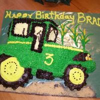 John Deere Tractor Cake Constructed from a 13 by 9 sheet cake and frosted using star tip to resemble a tractor.
