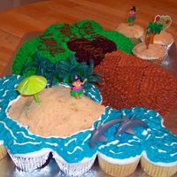 Luau Cake buttercream, graham crumbs for beach, water piping gel over blue bc