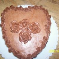 Chocolate Cake Im soo bad at taking pictures! It's really NOT this ugly in person ha Just a chocolate cake with chocolate buttercream, tip 12 dots...