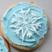Snowflake Cookie Sugar cookie frosted in buttercream with royal icing snowflake placed on top. Thanks for looking!