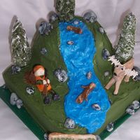 Deer Hunter Sleeping With A 30 Point Buck!!!! This was for my brothers 30th b-day, so i had to make a cake with a hunter sleeping and a 30 point buck. Cake is decorated in BC with MMF...