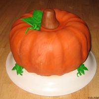 Pumpkin Cake I made two bundt cakes on top of each other and covered the cakes with fondant. Thanks for looking!