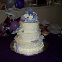 75Th Birthday Cake 8", 10", 12" rounds - all white cake with raspberry filling and ivory BC, with gumpaste flowers. I'm happy with the way...