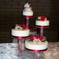 Wedding Cake 6", 8", 10" and 12" rounds (all different flavors) iced in whipped cream and topped with fresh flowers.