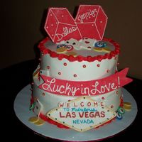 Lucky In Love Bridal shower cake for a couple getting married in Vegas. 8" & 10" white cakes filled with strawberry mousse, iced in BC....