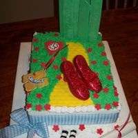 We're Off To See The Wizard! 1/4 sheet white cake filled with raspberry Swiss Meringue BC, iced in traditional BC. Gumpaste / fondant heart, medal of courage, diploma,...