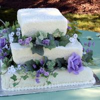 Square With Cornelli Lace My first wedding cake! 8", 12" and 16" squares, covered in MMF & cornelli piped in BC. Bride asked for white daisies,...