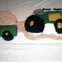 John Deere Tractor Cake This is all buttercream with smashed up shredded wheat cereal used for the hay.