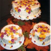 Fall Flowers All buttercream basketweave with fall colored flowers done in royal icing. One cake is cinnamon swirl, one is strawberry with strawberry...