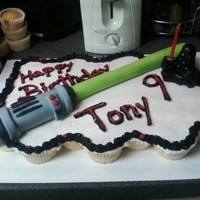 Star Wars Cupcakes This is a cupcake cake for my son. I made the light saber out of fondant