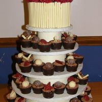 Mini Choc Pots Nearly 100 mini choc pots filled with chocolate cake, jam, mousse and ganache and decorated with chocolate decortions. Top cake decorated...