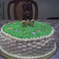 Easter Basket Buttercream grass and basketweave with royal icing flowers.