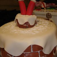 Help Santa! Made this for our annual holiday get together. The kids LOVED this one! Buttercream and MMF. The chimney part I made out of a cupcake. I...