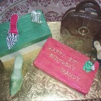 Shoes, Cake Boxes, Handbag This was my first time making any of these things, pleased with the end result.Shoes are gumpaste, shoe boxes are chocolate with cake...