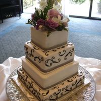 Square Wedding Cake All bc icing,silver ribbon and real flowers.