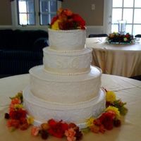 Ivory Wedding Cake All BC icing with real flowers and ribbon
