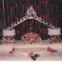 Fountain And Lillies This cake was for 400 people. Trimmed in pearls and iced in b/c. I did this one several years ago, but have done others in the same design...