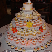 Fall Cupcake Wedding Cake Fall wedding for 200 people. Flavors were strawberry with french vanilla icing, yellow with orange icing and gluten-free chocolate with...