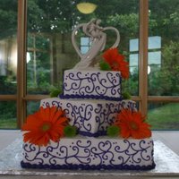 Gerbera Daisies all bc icing. Purple, green and orange wedding colors. I didn't think the colors would look good together, but the bride was pleased...