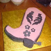 Cowgirl Boot My 8 year old daughter won 2nd place for this cowgirl boot decorated with rolled fondant. I had to help her get the shape right on the cake...