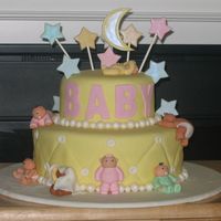 Wilton Design - Fondant Babies I did this cake for my friend's baby shower. It's a Wilton design. I just loved the babies. I made the babies a week in advance...