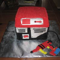 Pressure Washer I did this cake for a little boy who loved pressure washers, generators and tools. I was modeling it after the toy one that he has....