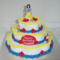 Snow White Strawberry and yellow cake. Iced in Buttercream , fondant flowers.