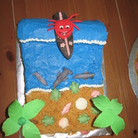 Surfing Crab On The Beach I made this cake for my daughters 6th birthday. She wanted a beach them and then we made candy surf boards for favors and she decided to...