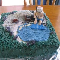 Diving Man Cake Diver sitting on the beach