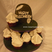 Ghosts And Gravestone Ghost cuppies and gravestone mini cake for a playgroup halloween party. yellow cake, cookies n cream filling, buttercream icing and mmf....