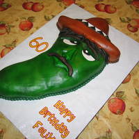 Chili Pepper Covered with buttercream icing. Icing colors all done with airbrush. Hair, eyes, eye brows, lips, and mustache done with fondat