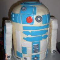 R2D2 12" tall cake - chocolate, vanilla, lemon, marble. BC icing and MMF accents. Styrofoam arms covered with MMF; arms aren't...