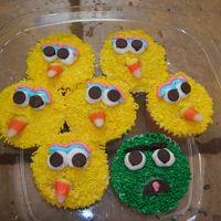 Big Bird, Oscar, Elmo, Cookie Monster Cupcakes - Sesame Street All frosted then dipped into same color sprinkles. Eyes are mini chocolate chips upside down. I used a candy corn for Bird's beak!...