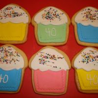 Cupcake Shape Birthday Cookies NFSC for a 40th Birthday with Rolled fondant, RI and non-pariels. I used my fondant cutter/roller for the impression of the cupcake paper,...