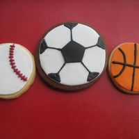 Sports Balls, Baseball, Soccer Ball, Basket Ball Cookies NFSC with rolled satin ice fondant and RI decoration details. I printed a pentagon template and cut the soccer ball center shape by hand...