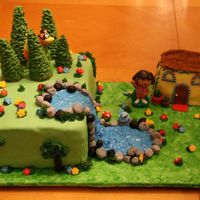 Dora Birthday Cake I made this for my daughter's 2nd birthday. Everything is edible except for Dora, Boots, and Swiper. Dora's house is made of rice...