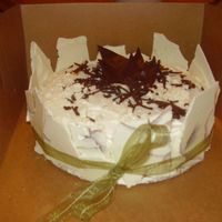 013_-_Copy.jpg White cake soaked in Godiva white chocolate liquor with dulce de leche filling, covered in white chocolate shards, tied with green ribbon...