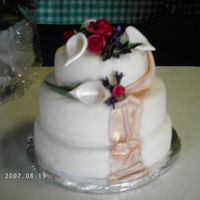 For My Grandma's 90Th B-Day I've never actually taken a Wilton class, but this is my first stacked cake, first fondant cake, and third time with gumpaste flowers...