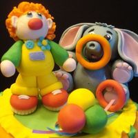 Clown And Elephant 50/50 gumpaste and fondant clown and elephant for the top of my circus cake I did for practice. Great fun!